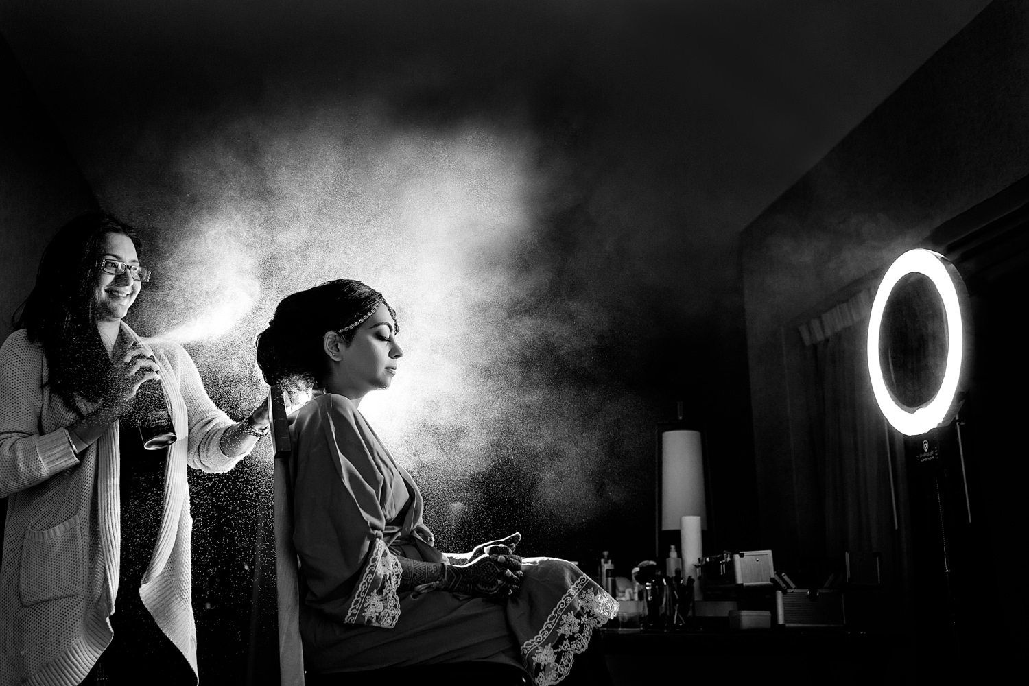 This was an Indian wedding on the Eastern Shore, Maryland, The black and white photo is of the bride getting her hair done, I took a flash and lit up the hairspray so it looks like a bright cloud of smoke illuminating behind the bride's head, We work hard to make your wedding images unique and bold, Procopio Photography, best top Washington DC photographer, best top Maryland photographer, best top Virginia photographer, best top DMV photographer, best top wedding photographer, best top commercial photographer, best top portrait photographer, best top boudoir photographer, modern fine art portraits, dramatic, unique, different, bold, editorial, photojournalism, award winning photographer, published photographer, memorable images, be different, stand out