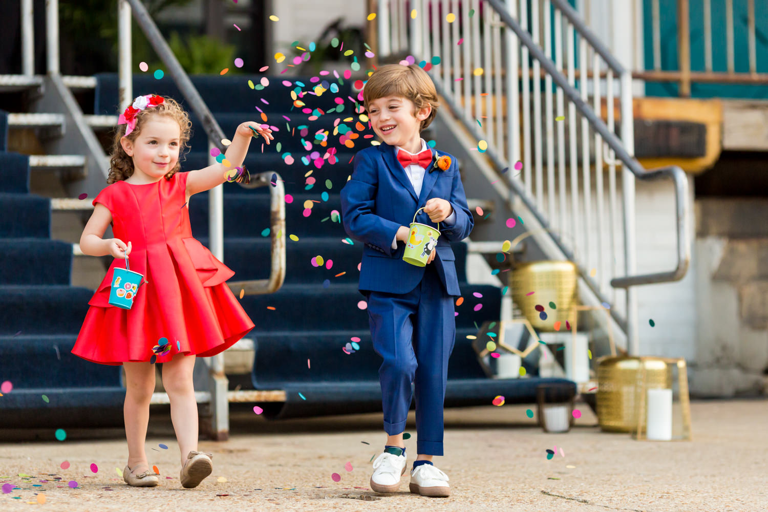 Washington DC, Union Market, Dock 5, this was an outdoor ceremony with the flower girl and ring bearer throwing rainbow confetti as they walk down the aisle, the ring bearer is in a cobalt blue suit and a coral tie and the flower girl is in a bright coral dress, they are giggling and confetti is all around them, Procopio Photography, best top Washington DC photographer, best top Maryland photographer, best top Virginia photographer, best top DMV photographer, best top wedding photographer, best top commercial photographer, best top portrait photographer, best top boudoir photographer, modern fine art portraits, dramatic, unique, different, bold, editorial, photojournalism, award winning photographer, published photographer, memorable images, be different, stand out