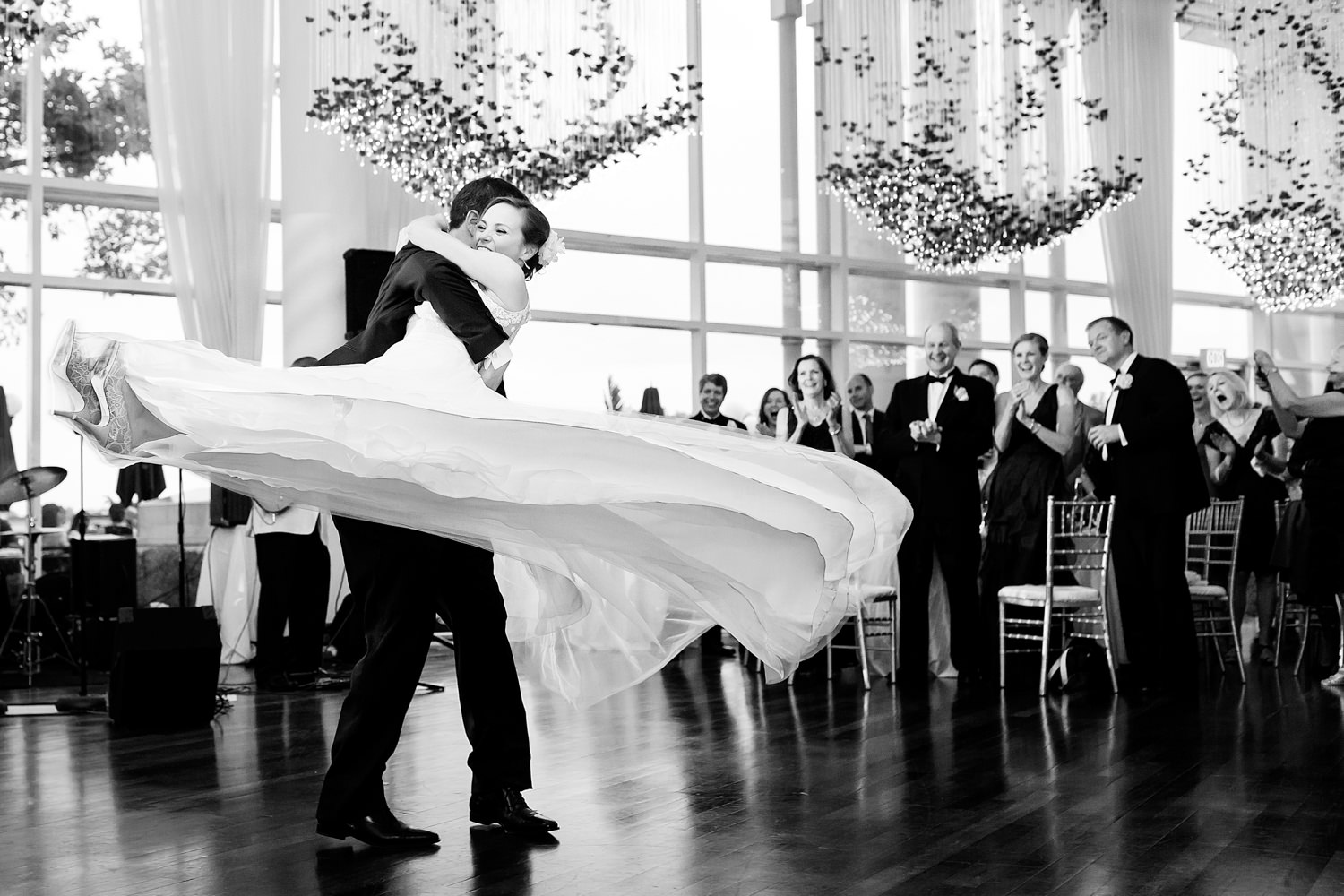 This is a Washington DC, Georgetown, Sequoia wedding, During the first dance, the groom literally sweeps the bride off her feet and twirls her around, This black and white photo shows her dress as it swirls around in the air with the groom carrying the bride in a dizzying circle, Catching the moment, Procopio Photography, best top Washington DC photographer, best top Maryland photographer, best top Virginia photographer, best top DMV photographer, best top wedding photographer, best top commercial photographer, best top portrait photographer, best top boudoir photographer, modern fine art portraits, dramatic, unique, different, bold, editorial, photojournalism, award winning photographer, published photographer, memorable images, be different, stand out