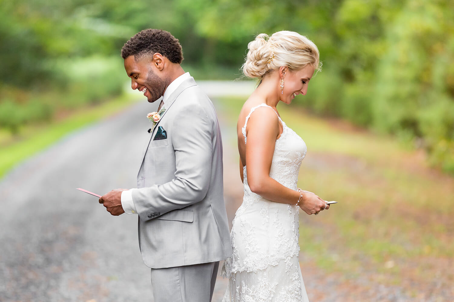 At this first look this couple chose to read letters to each other before turning around to see each other, black groom, white bride, grey suit, eastern shore wedding