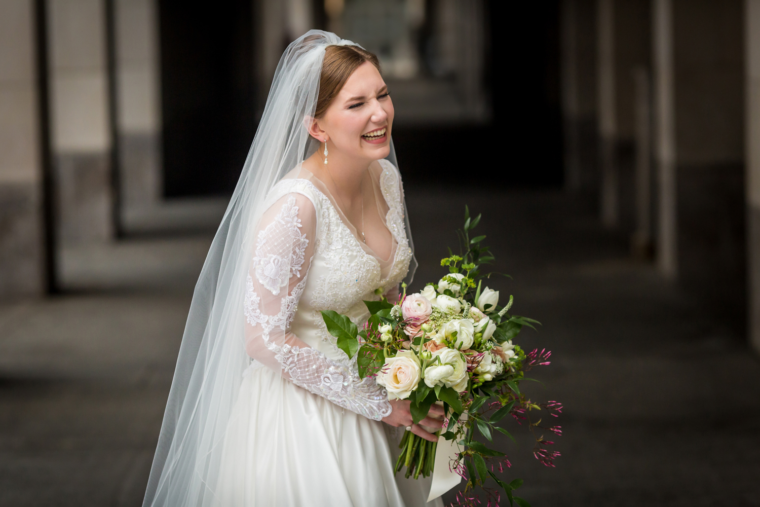 Procopio Photography, best top Washington DC photographer photography, best top Maryland photographer photography, best top Virginia photographer photography, best top DMV photographer photography, best top commercial photographer photography, best top wedding photographer photography, best top portrait photographer photography, best top boudoir photographer photography, modern fine art portraits, dramatic, unique, different, bold, editorial, photojournalism, award winning photographer, published photographer, memorable images, be different, stand out, luxe wedding, luxury wedding, luxury portraits, luxury boudoir, bespoke, Ronald Reagan Building, bridal portraits, natural portraits, bride laughing and holding her bouquet with the RRB arches behind her